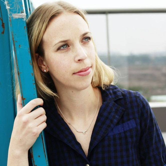 silver branch necklace with blue gemstone