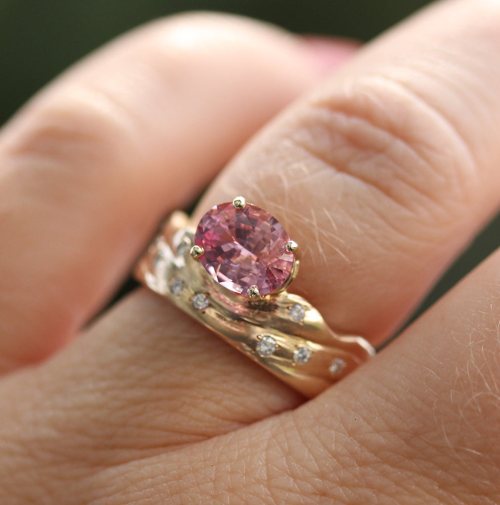 pink gemstone ring on the finger