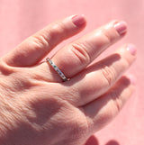 Water band in silver with teal sapphire and emerald