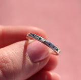 Water band in silver with teal sapphire and emerald