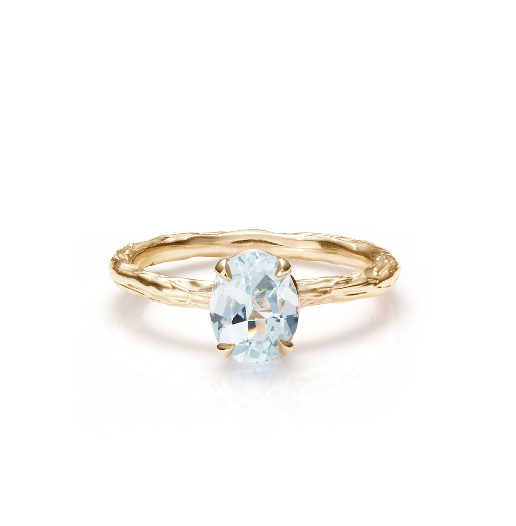 Aquamarine ring on white background