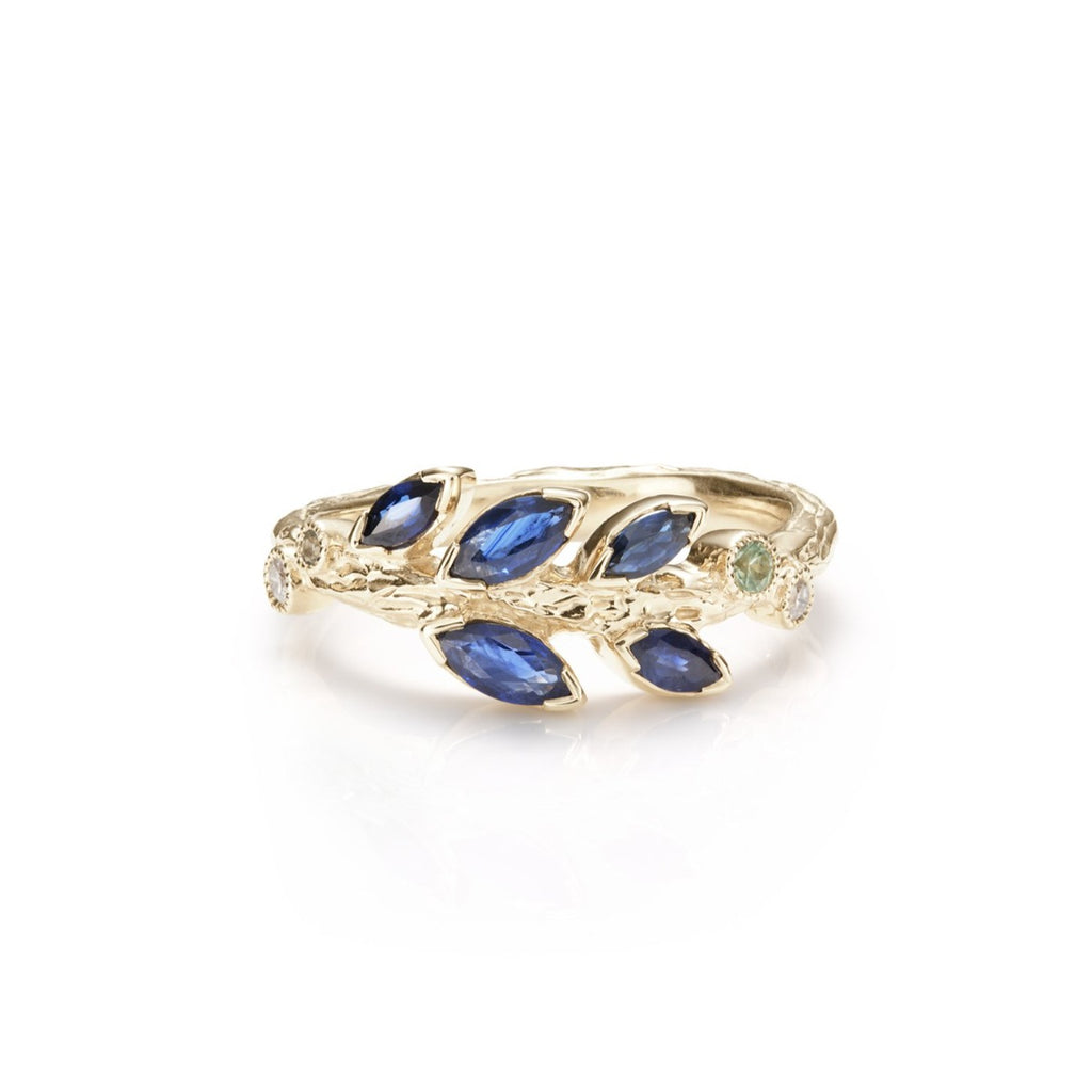 Yellow gold ring with blue sapphire leaf design