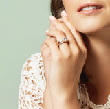 Halo engagement ring on hand