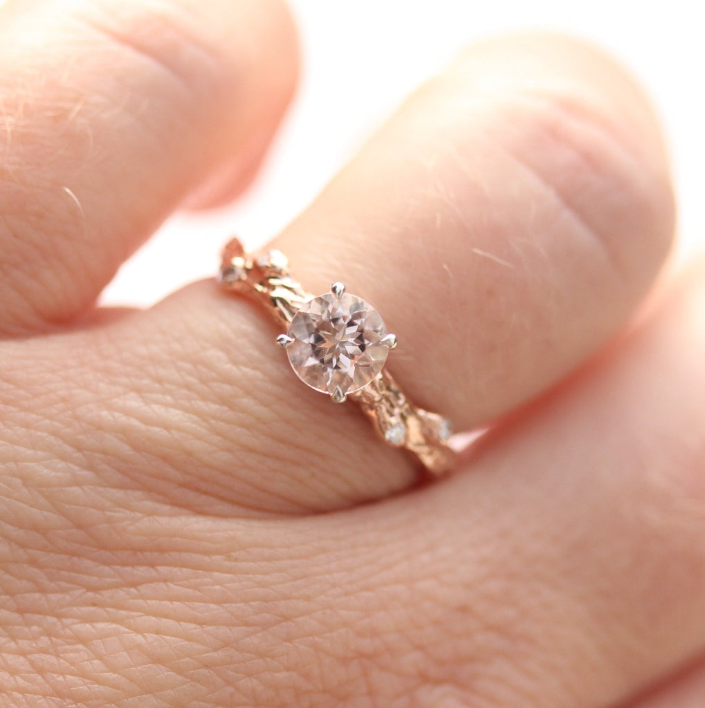Rose gold and pale pink ring on the finger