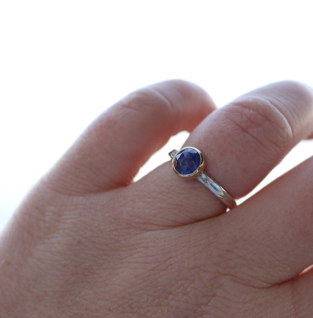 Sapphire and emerald two tone ring