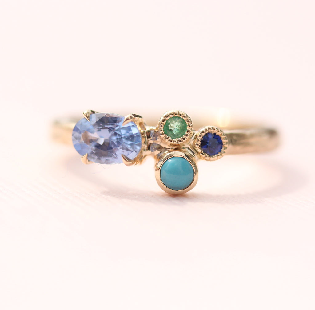 cluster ring with blues and greens