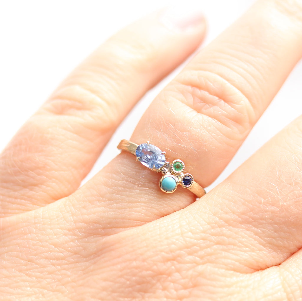 blue gemstone sapphire ring on the finger