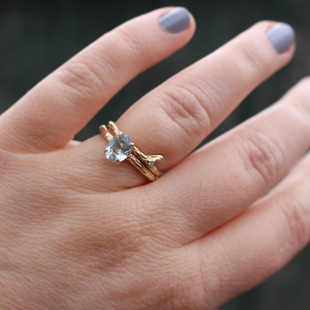 aquamarine ring with branch ring on the hand
