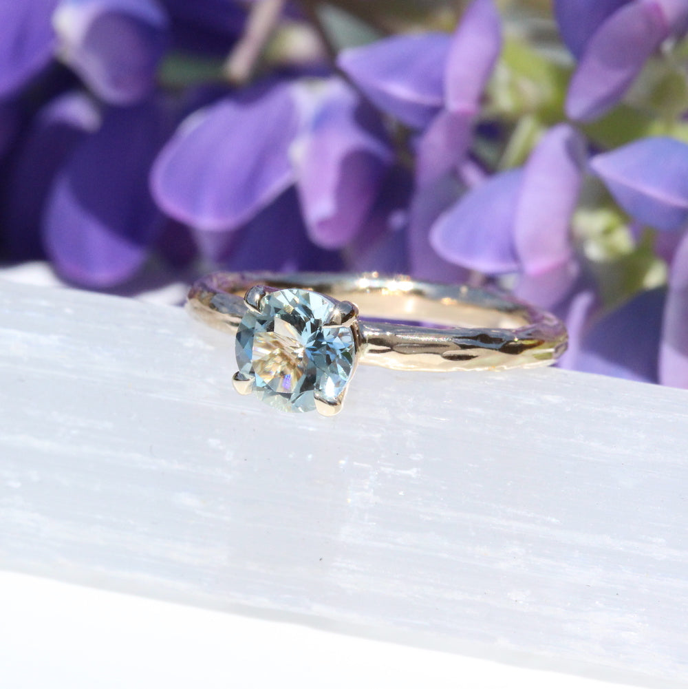 Pale blue gemstone engagement ring