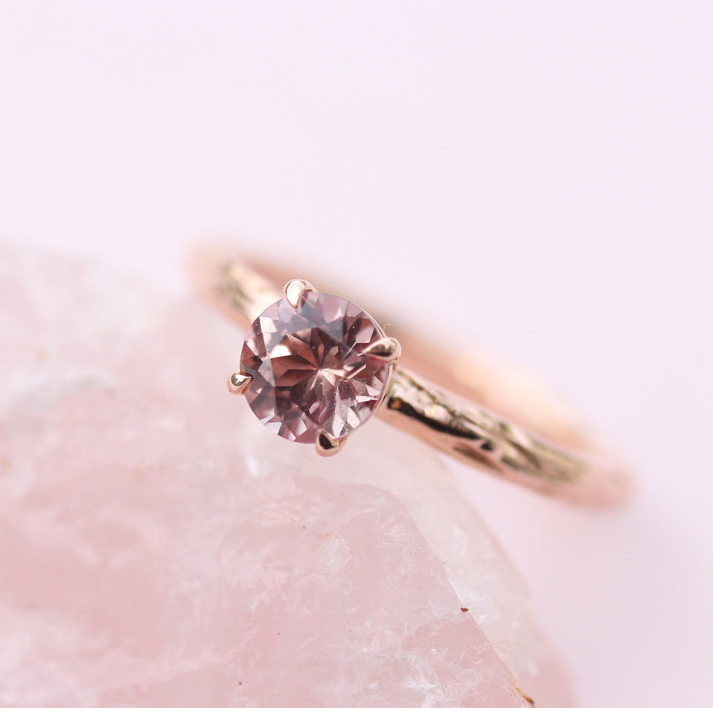 garnet solitaire on rose quartz rock