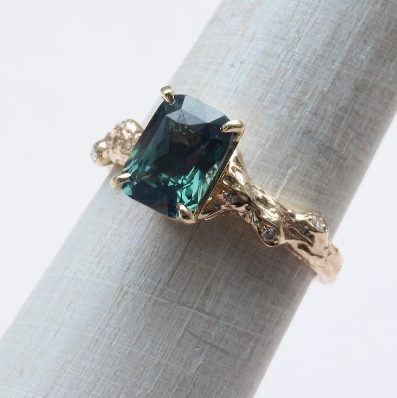 Green emerald cut sapphire ring
