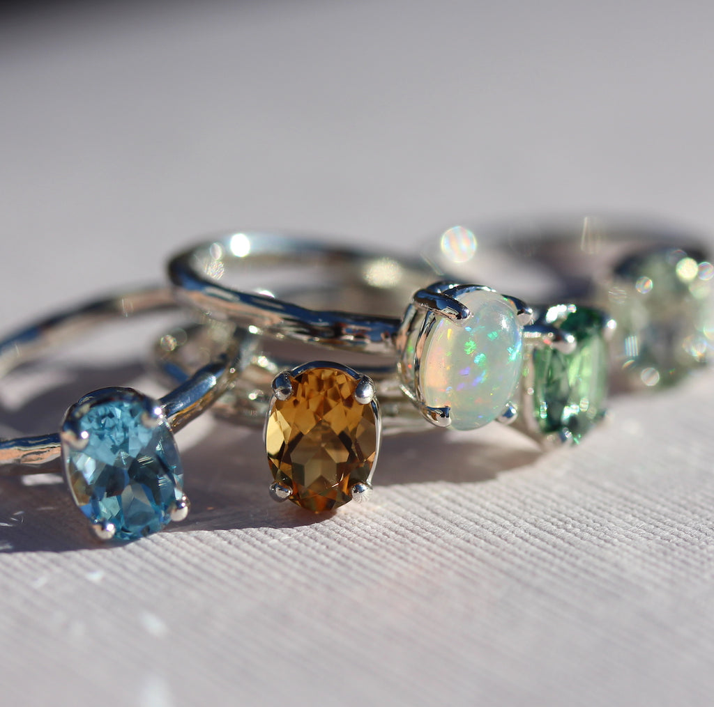 oval gemstone rings grouped together by kathryn rebecca