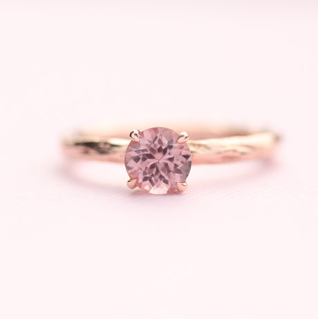 pink garnet ring on pink paper