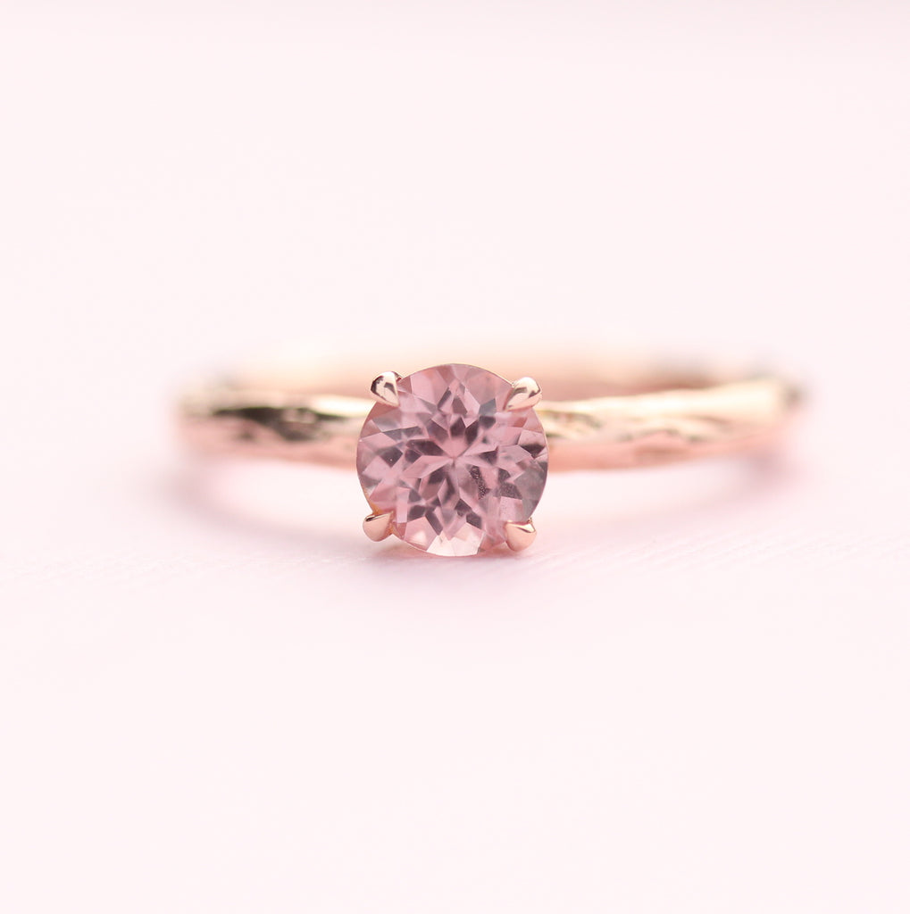 pink garnet ring on pink paper
