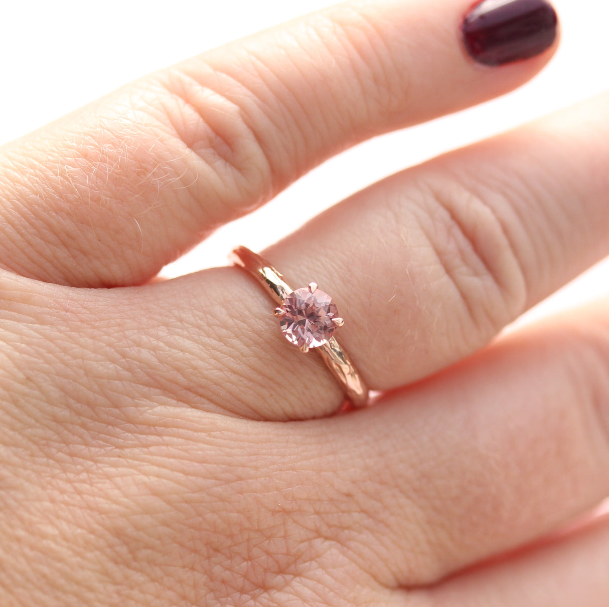 rose gold ring on finger