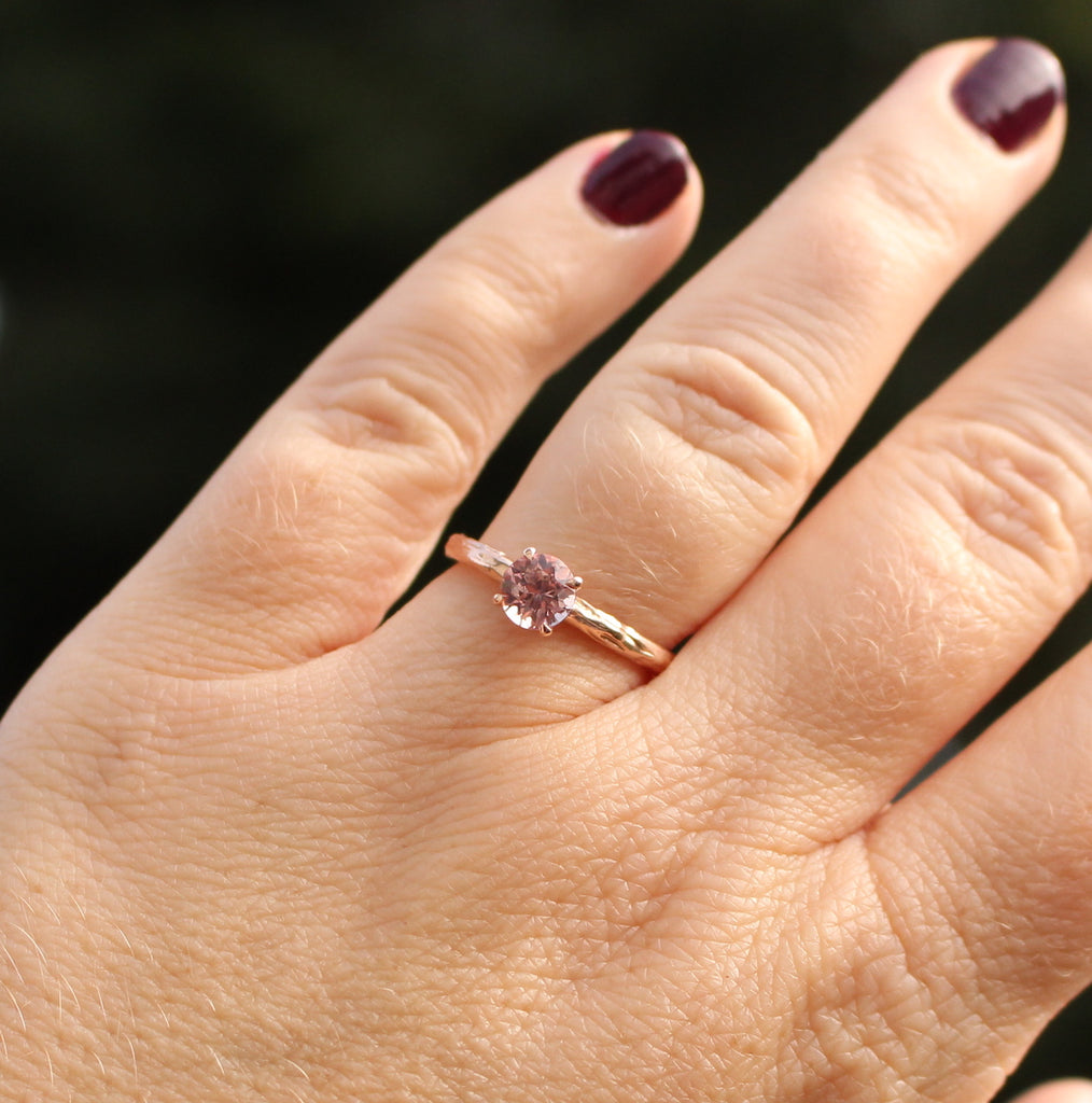 pink garnet ring on the hand