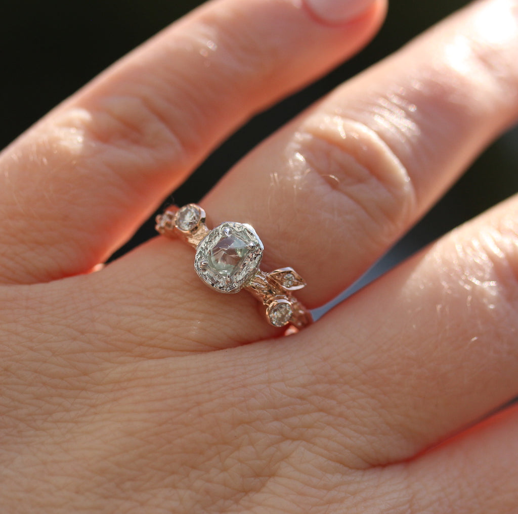 Rough diamond ring on a hand