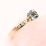 Teal Sapphire ring with diamonds on the band by Toronto  jewelry designer