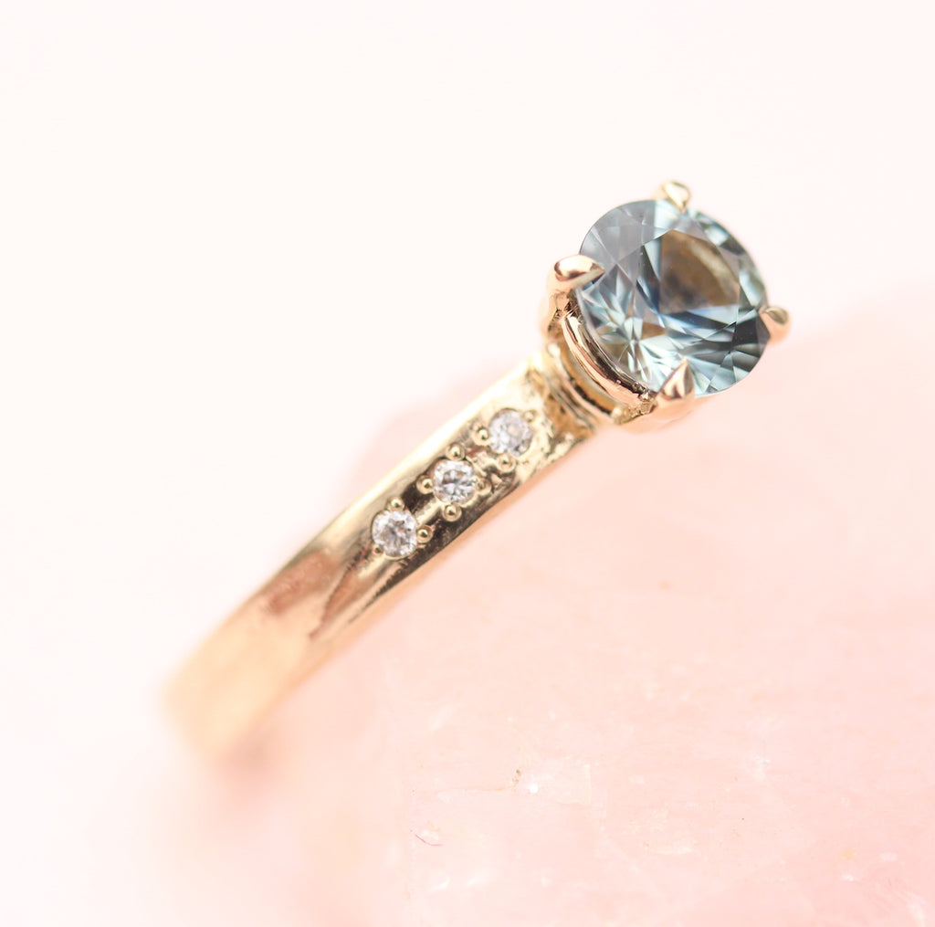 Teal Sapphire ring with diamonds on the band by Toronto  jewelry designer